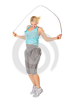 Woman jumps with skipping rope