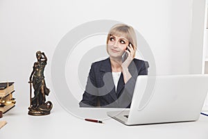 Woman jurist talking phone isolated in office. photo
