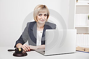 Woman jurist working laptop in office isolated.