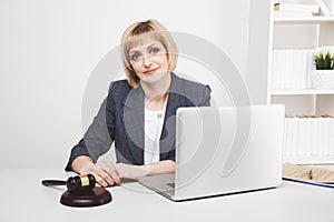 Woman jurist working laptop in office isolated.