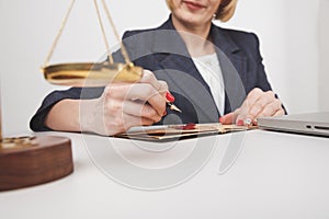 Woman jurist writing on the paper document isolated. photo