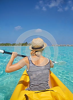 Woman, kayak and tropical ocean in summer in hat, mockup space or blue sky background by island. Person, boat or back