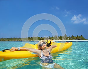 Woman, kayak and tropical sea in summer with sunglasses, mockup space and blue sky background by island. Person, boat or