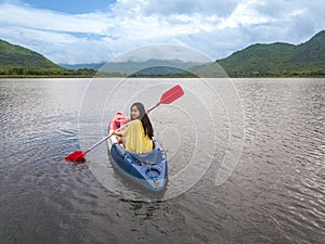 Woman kayaking on lake