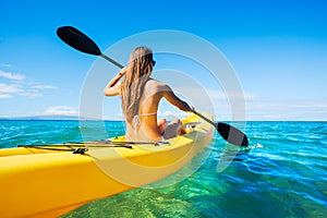 Woman Kayaking in the Ocean on Vacation