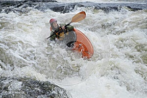 Woman kayaking in river