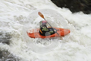 Woman kayaking in river