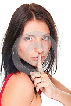Woman keep quiet gesture finger on mouth isolated