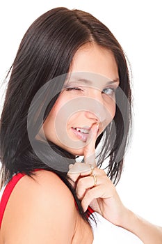 Woman keep quiet gesture finger on mouth isolated