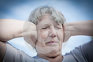 Woman keeping her ears shut