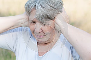 Woman keeping her ears shut