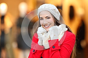 Woman keeping warm in winter in a mall