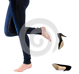 Woman kick off her shoes