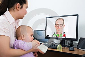 Woman With Kid In Online Video Conference Call