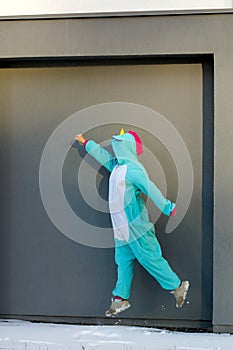 Woman in kigurumi unicorn costume