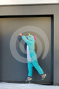 Woman in kigurumi unicorn costume