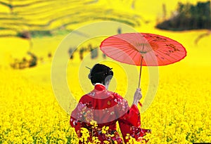Woman in kimono walking away, back view