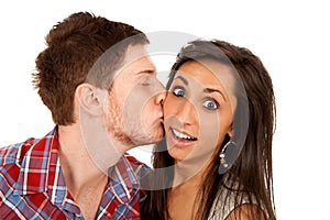 Woman kisses her boyfriend on the cheek