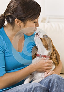 Woman Kissing Dog