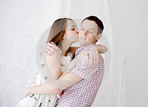 Woman kissing her boyfriend in cheek