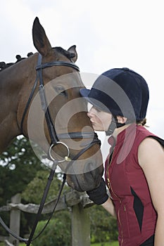 Woman Kissing Horse