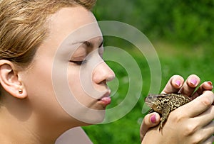 Woman kissing a toad