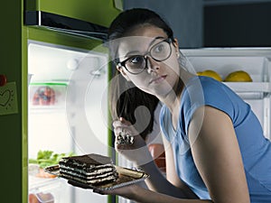 Woman having a late night snack photo