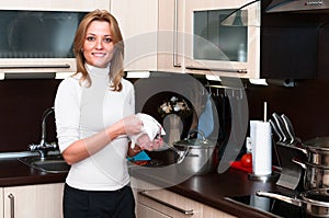 Woman in kitchen interior