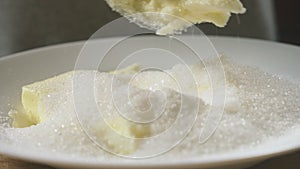 A woman in the kitchen makes a cake. Preparation of cream. 4k, slow-motion shooting. bodily shot