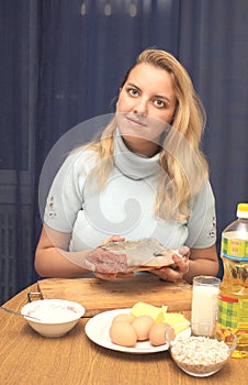 Woman on kitchen makes a dinner