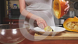 Woman in the kitchen making a pumpkin pie. 4k, slow-motion shooting. dolly shot