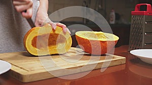 Woman in the kitchen making a pumpkin pie. 4k, slow-motion shooting. dolly shot