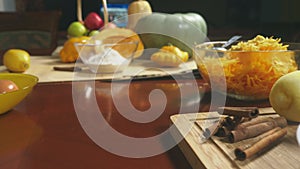 Woman in the kitchen making a pumpkin pie. 4k, slow-motion shooting. dolly shot