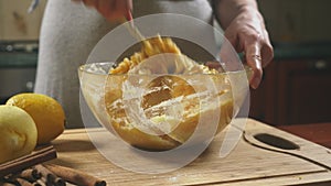 Woman in the kitchen making a pumpkin pie. 4k, slow-motion shooting. dolly shot