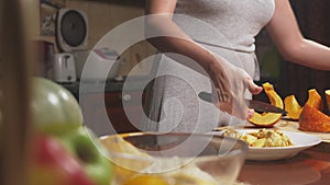 Woman in the kitchen making a pumpkin pie. 4k, slow-motion shooting. dolly shot