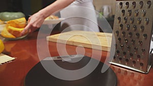 Woman in the kitchen making a pumpkin pie. 4k, slow-motion shooting. dolly shot