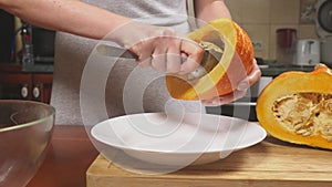 Woman in the kitchen making a pumpkin pie. 4k, slow-motion shooting. dolly shot