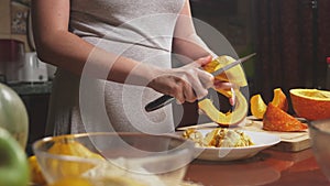 Woman in the kitchen making a pumpkin pie. 4k, slow-motion shooting. dolly shot