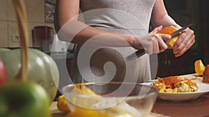 Woman in the kitchen making a pumpkin pie. 4k, slow-motion shooting. dolly shot
