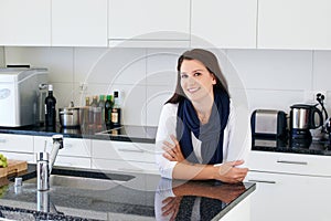 Woman, kitchen and portrait with smile in home, chef and employee for small business. Catering, relax and calm for