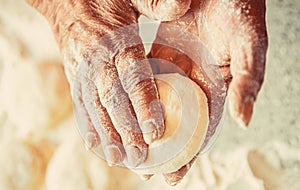 Woman kneading and making a pie. Homemade cakes dough in the women's hands. Process of making pies, hand. Hands pie