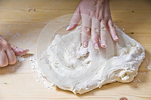 Woman Kneading Pizza Dough