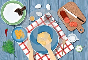 Woman kneads the dough on a blue table. View from above. Cooking pizza. Ingredients on the table.  illustrtion