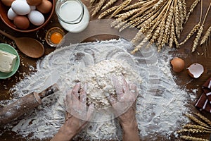 A woman kneads dough for Easter bread