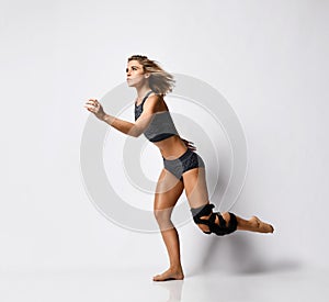 Woman with knee brace. Isolated.