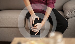 Woman with knee pain concept. Health issues.