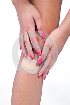 Woman knee with patch