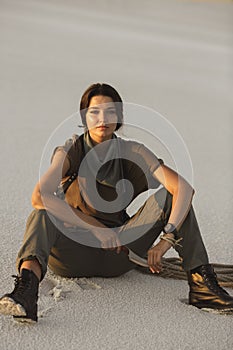 Woman With a Knife Outdoors in Desert