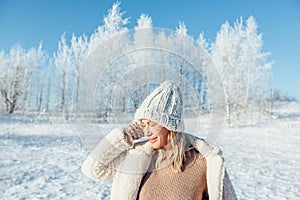 Woman in knitted hat in magic winter day