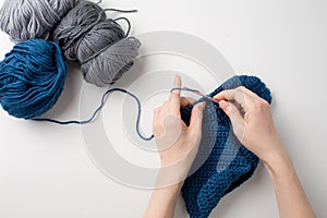 Woman Knitting Handcrafting with Thread and Needle